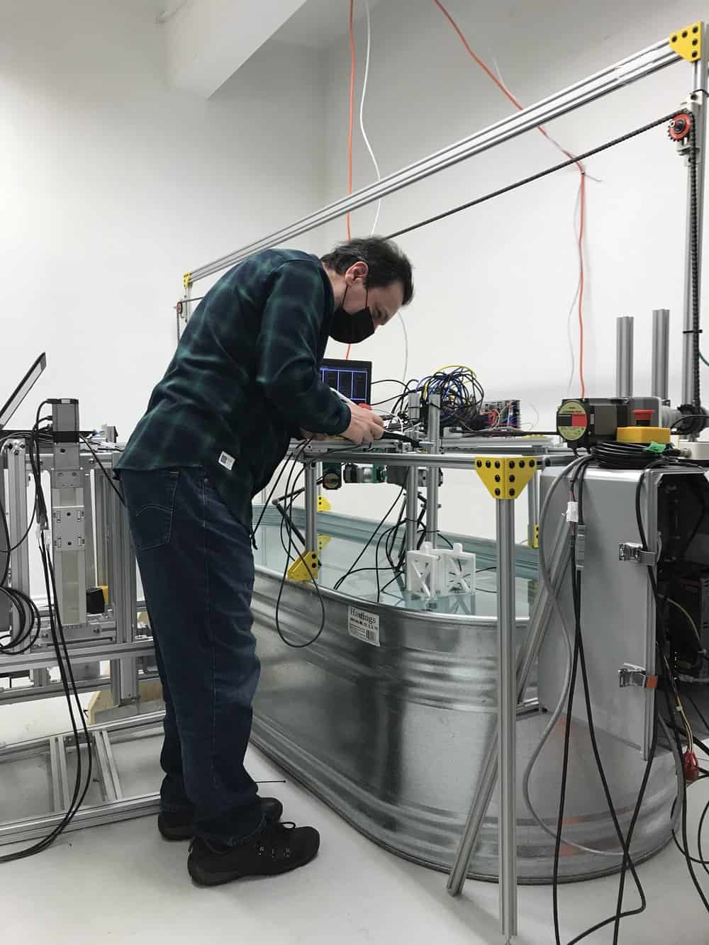 Technician checking underwater vision system